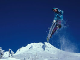 Kim Kardashian Shows Off Deep Cleavage In Plunging Top & Mini